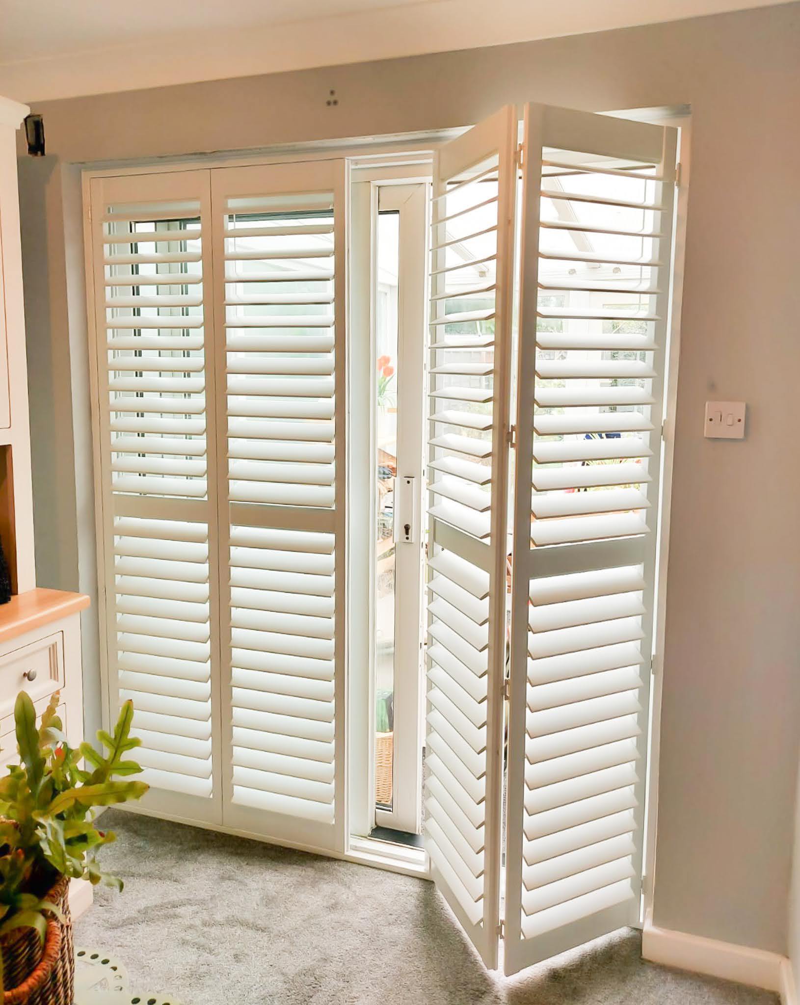 Bi-fold shutters on a large window opening